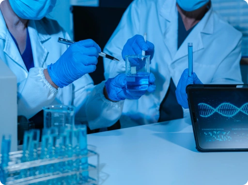 Scientists performing pharmaceutical research in a laboratory, analyzing chemical samples and biotechnology data for drug development.