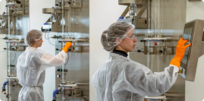 Pharmaceutical manufacturing professional operating processing equipment