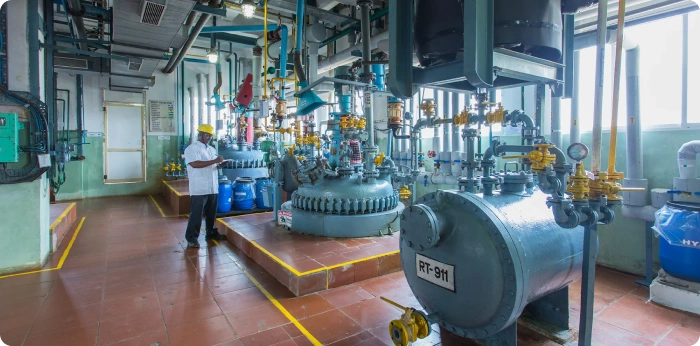Modern pharmaceutical API manufacturing facility with industrial processing equipment and production systems