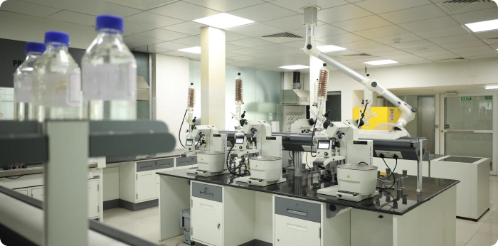 In vitro biology laboratory with automated instruments supporting cell culture and molecular assays for drug discovery and preclinical testing