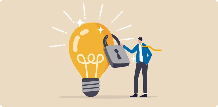 Business professional unlocking lightbulb symbol representing intellectual property protection and innovation security