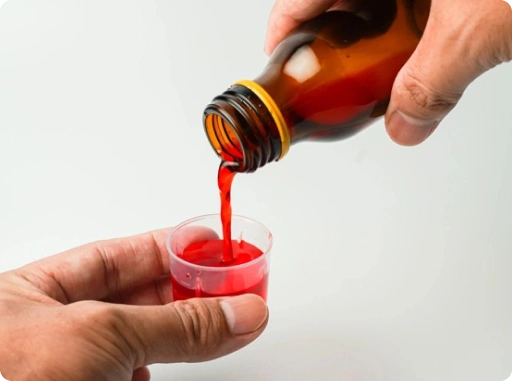 Measuring and administering an oral liquid drug formulation using a dosing cup