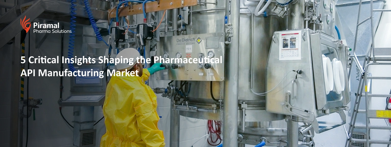 Technician operating pharmaceutical API manufacturing equipment in GMP-certified facility