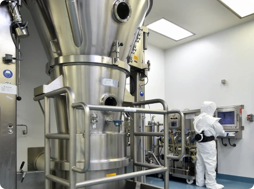 Close-up of pharmaceutical research documents and data analysis on computer screen